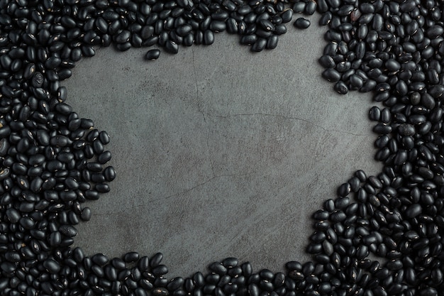 black beans and bare cement background