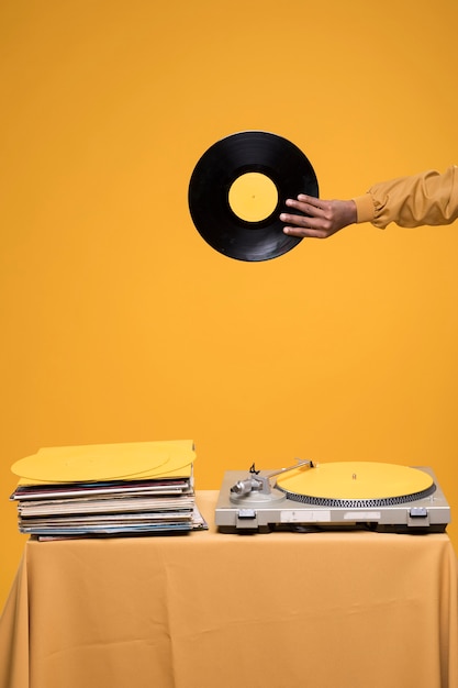 Free photo black boy posing with vinyls