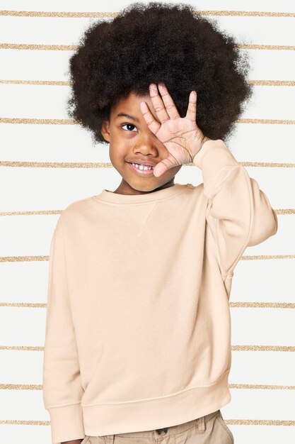 Black boy wearing cream sweater