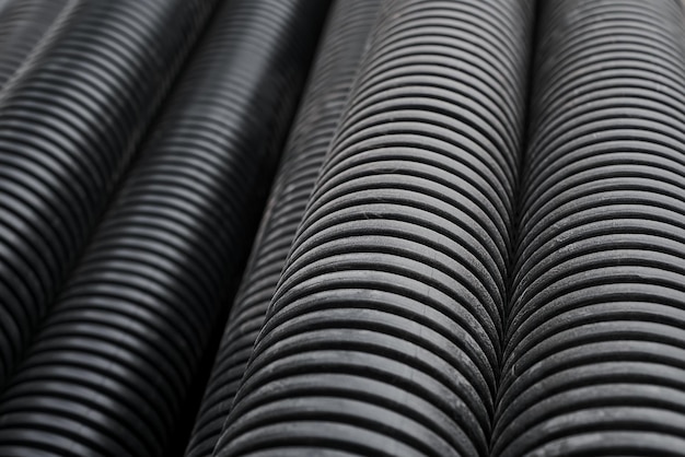 Free Photo black building pipes selective focus coated corrugated pipes for road and electrical network repair top view reconstruction and improvement of the social infrastructure of cities