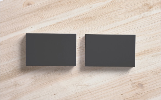 Free Photo black business cards stacks on wooden background. template to showcase your presentation.