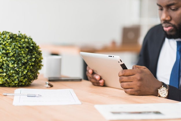 Black businessman with tablet