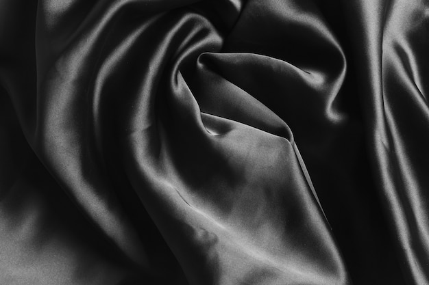 Free photo black curvy silk fabric material