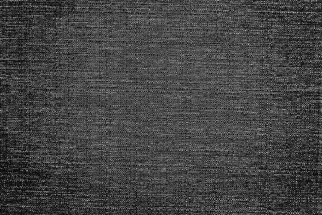 Black fabric rug with a textured background