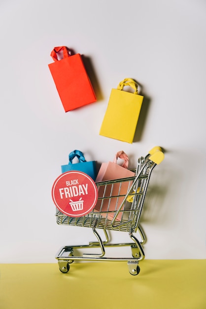 Free Photo black friday composition of bags in shopping cart