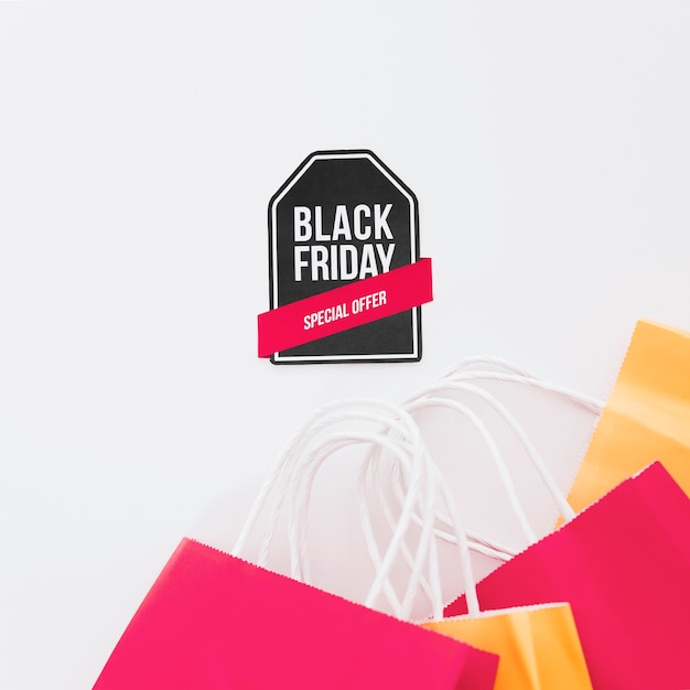 Black friday composition with label and shopping bags