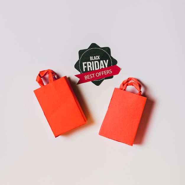 Free Photo black friday composition with red bags and label