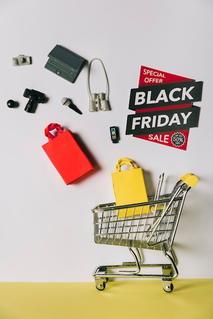 Free Photo black friday concept with products falling into cart