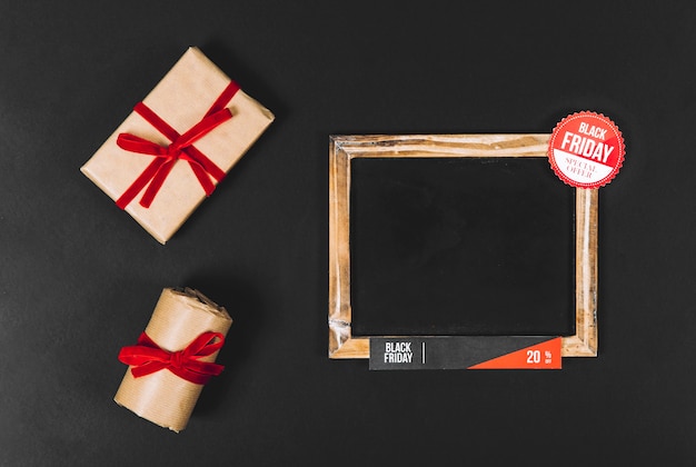 Free photo black friday concept with slate and gift boxes