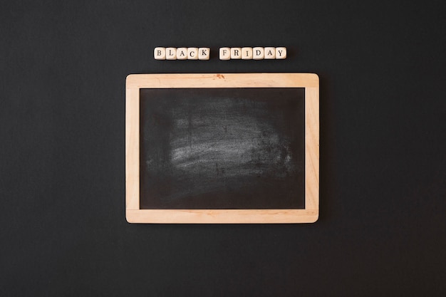 Free photo black friday inscription on cubes with chalkboard