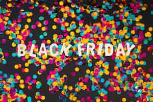 Free photo black friday inscription from wooden letters with confetti