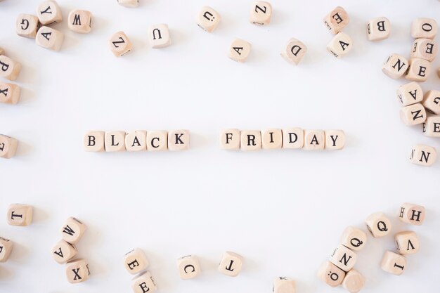 Black Friday inscription on small cubes on light table 