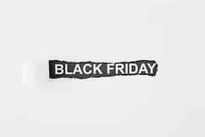 Free photo black friday inscription under torn paper