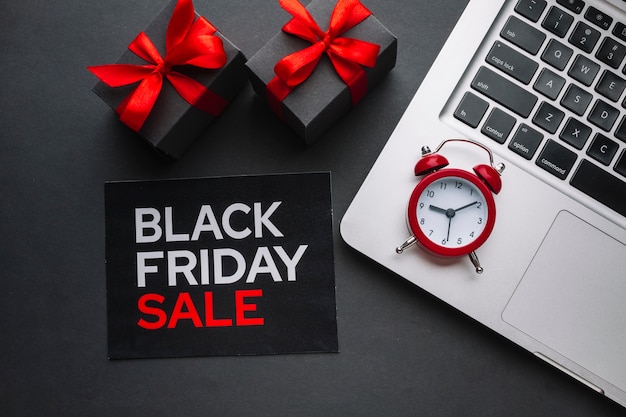 Free photo black friday sale flat lay with alarm clock