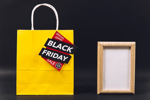 Free photo black friday sales composition with frame and bag