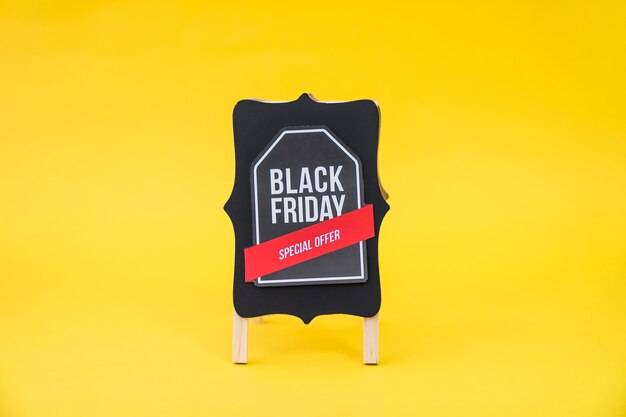 Black friday sales concept with label on board