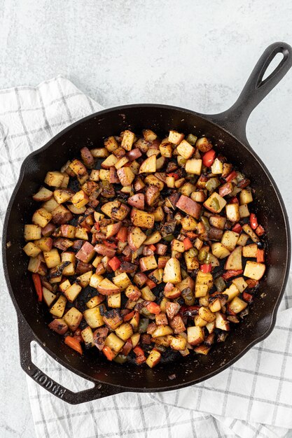 Black frying pan with fried food