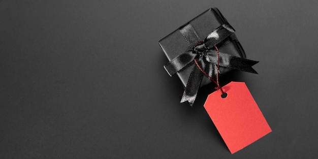 Black gift with red tag