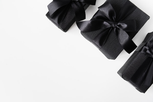 Black gifts on plain background