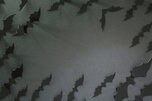 Free photo black halloween bats laid in circle