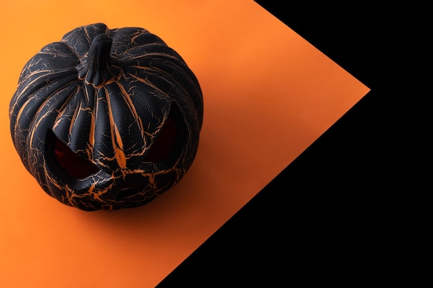 Black Halloween pumpkin on black and orange background