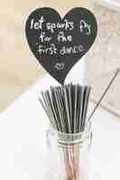 Free photo black heart with lettering 'let sparks fly for the first dance'