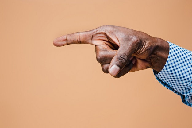 Black male hand point finger. Hand gestures - man pointing on virtual object