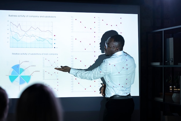 Black man giving presentation on a meeting