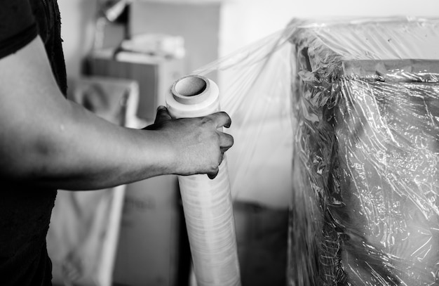 Black man moving furniture