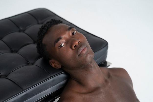 Black man posing in studio high angle