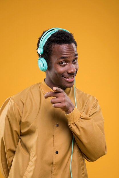 Black model posing with headphones