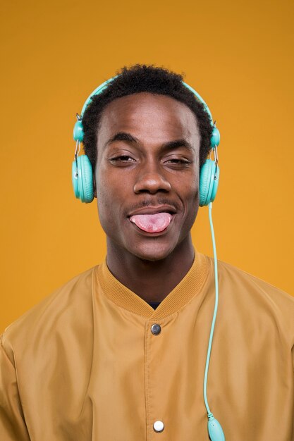 Black model posing with headphones