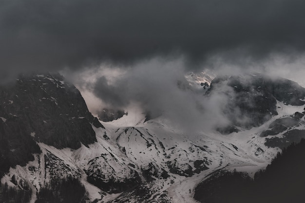 Black Mountain Covered by Snow Near Water