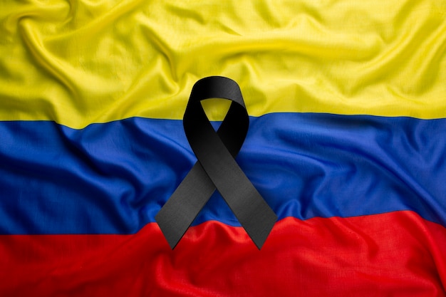 Free photo black mourning ribbon with colombia flag