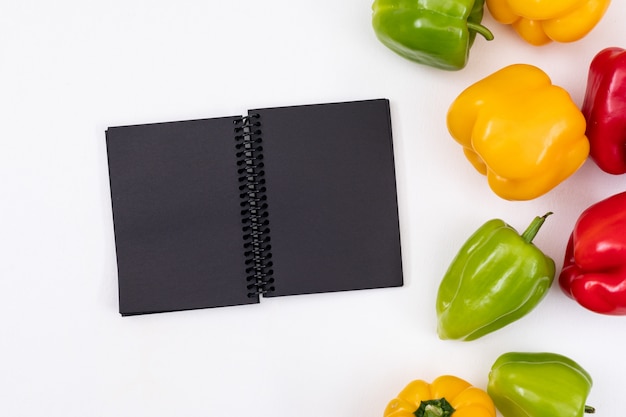 Black notebook with colorful peppers