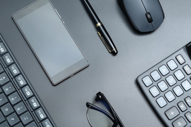 black office business equipment on black background