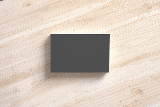 Black paper business cards stack on wooden desks. Template to showcase your presentation.