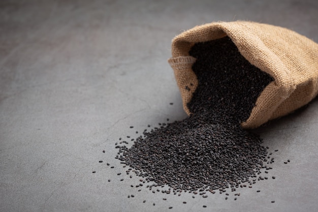 Black sesame in the sack on dark background