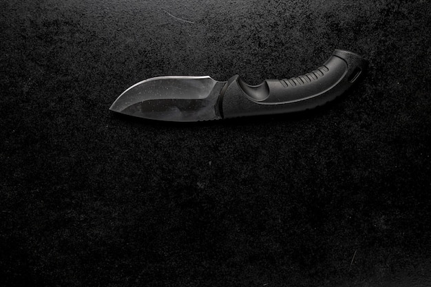 Free photo black sharp small knife with black handle