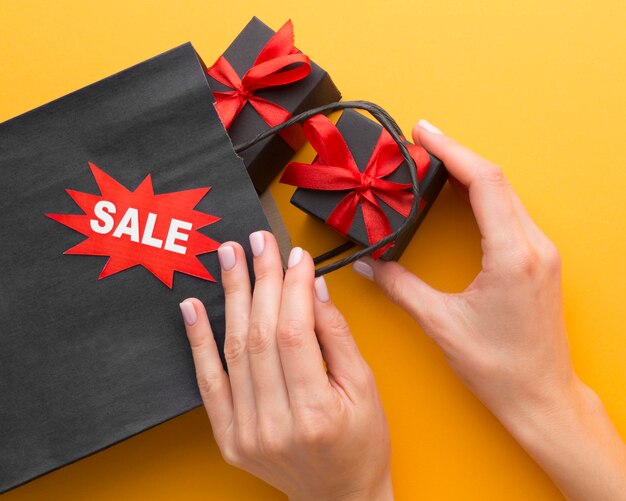 Black shopping bag and gift boxes