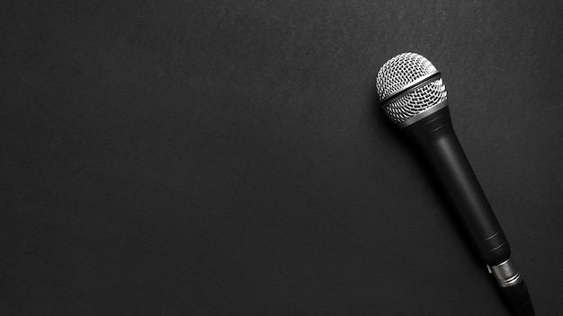 Free Photo black and silver microphone on a black background