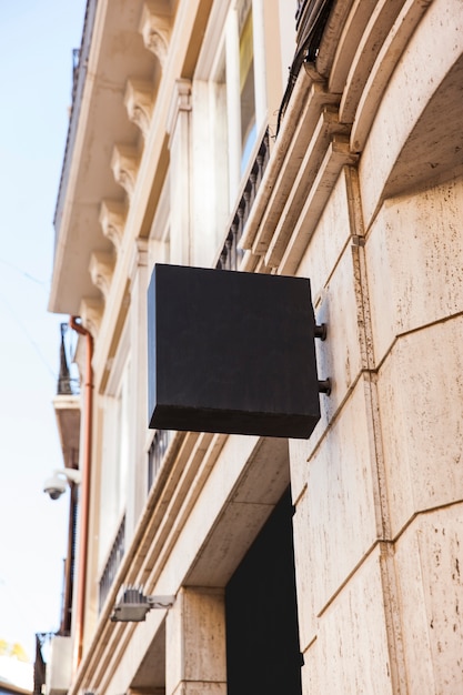 Black square sign in city