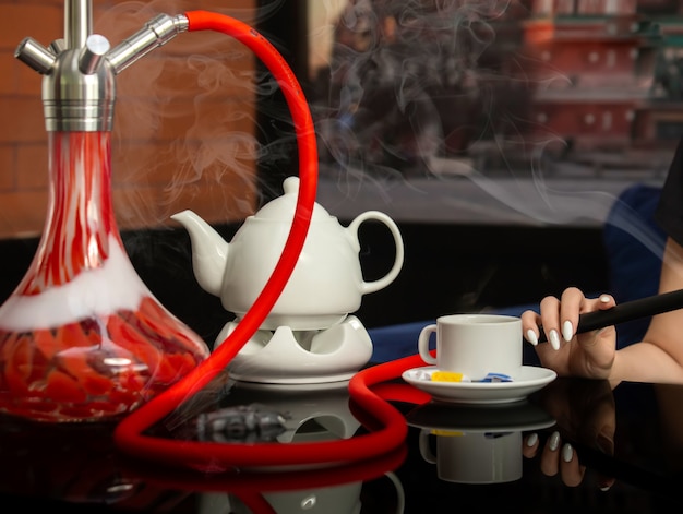 Black tea with shisha on the table