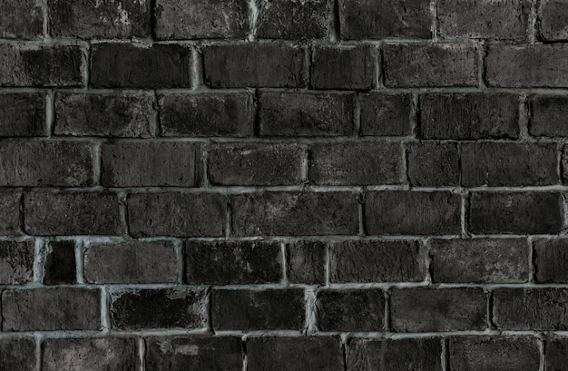 Free photo black textured brick wall background