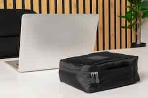 Free photo black toilet bag and laptop