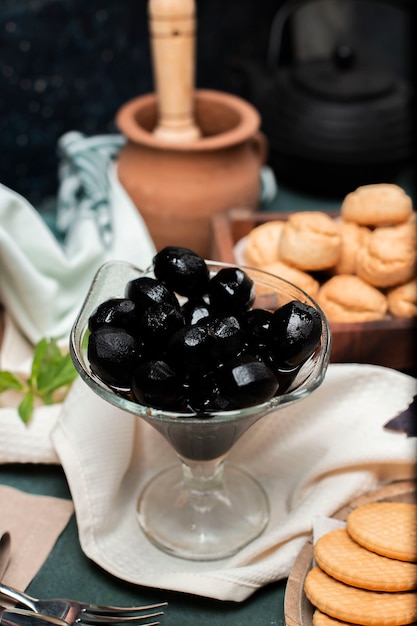 Black traditional walnut confiture in a glass jar