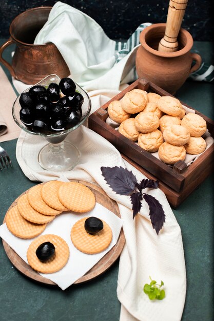 Black traditional walnut confiture with cookies and biscuits