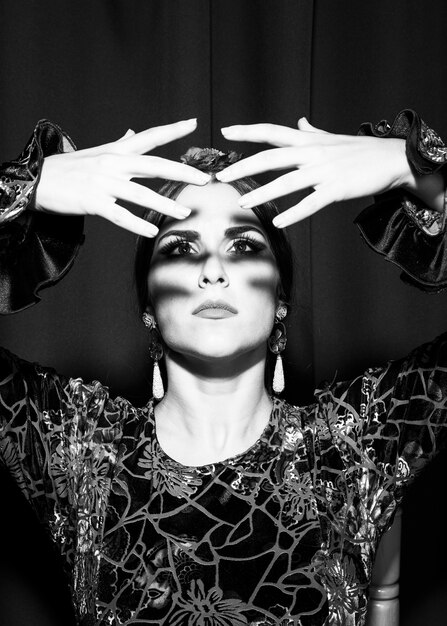 Free Photo black and white flamenca dancer looking at hands