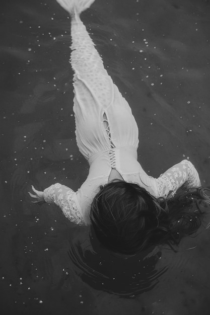 Free photo black and white mermaid in water