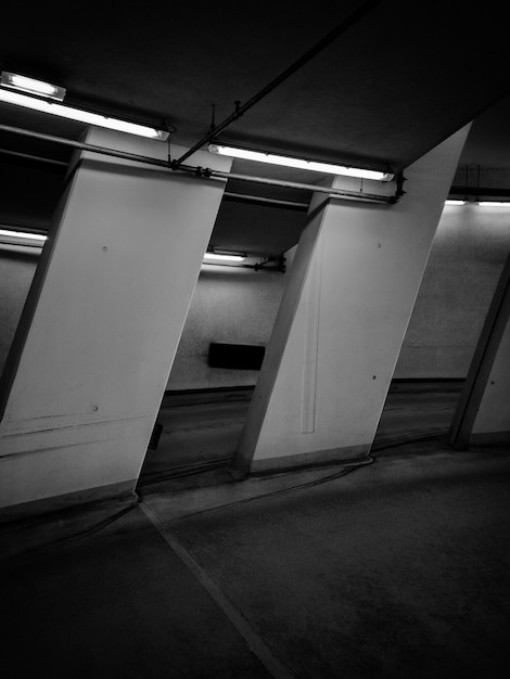 Black and white photo of room with neon lights